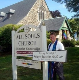 Outside All Souls at the sign